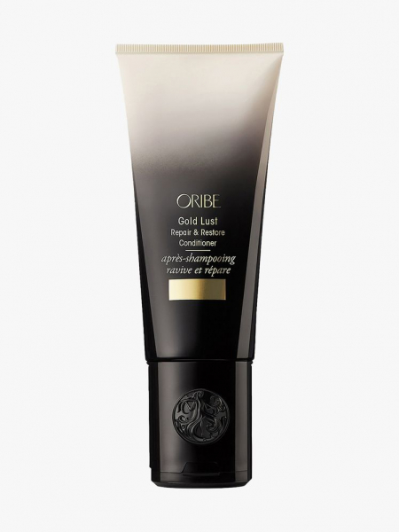 Oribe Gold Lust Repair & Restore Conditioner white to black gradient tube on light gray background